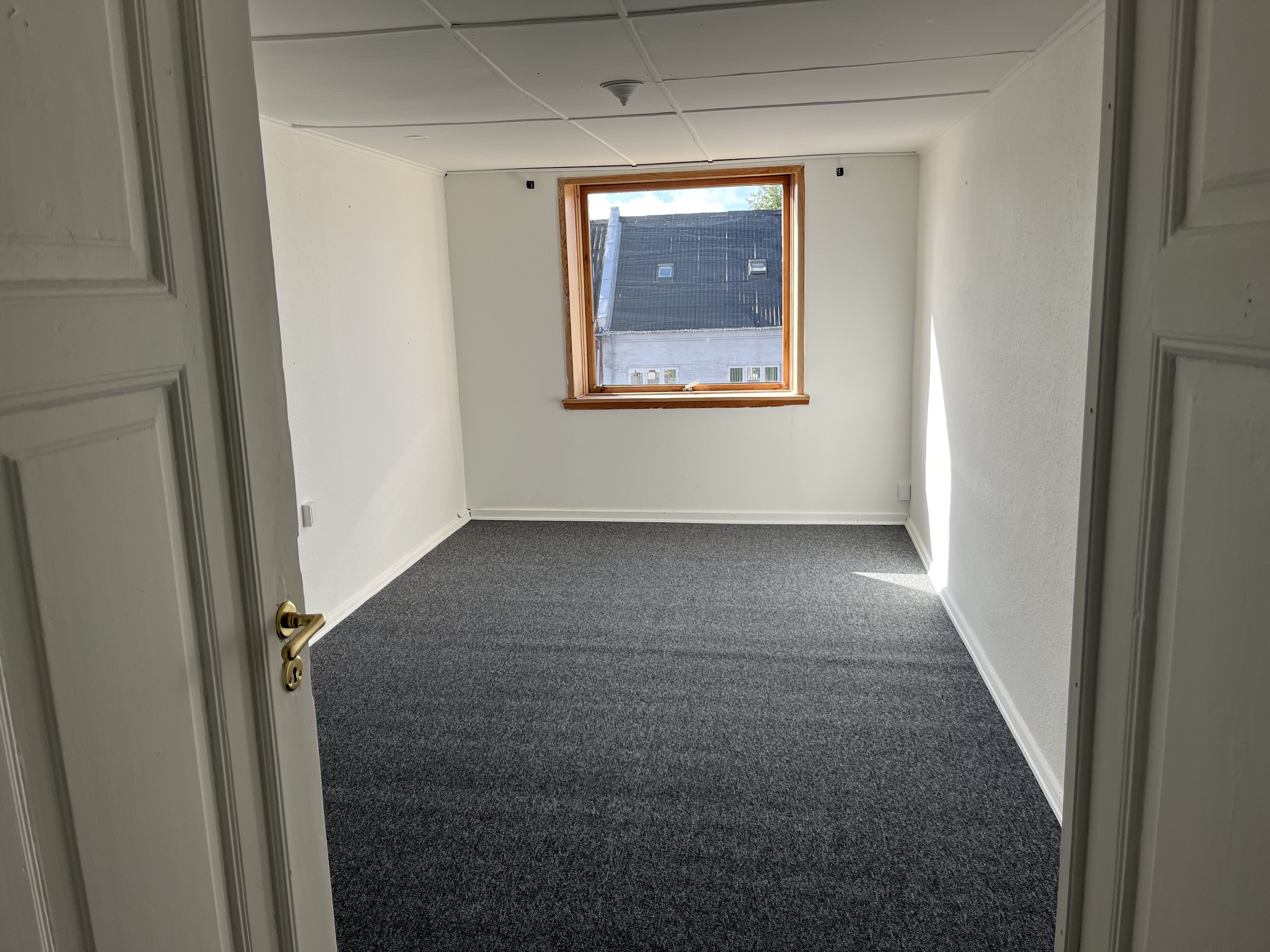 Stor lejlighed midt i Bredsten by
