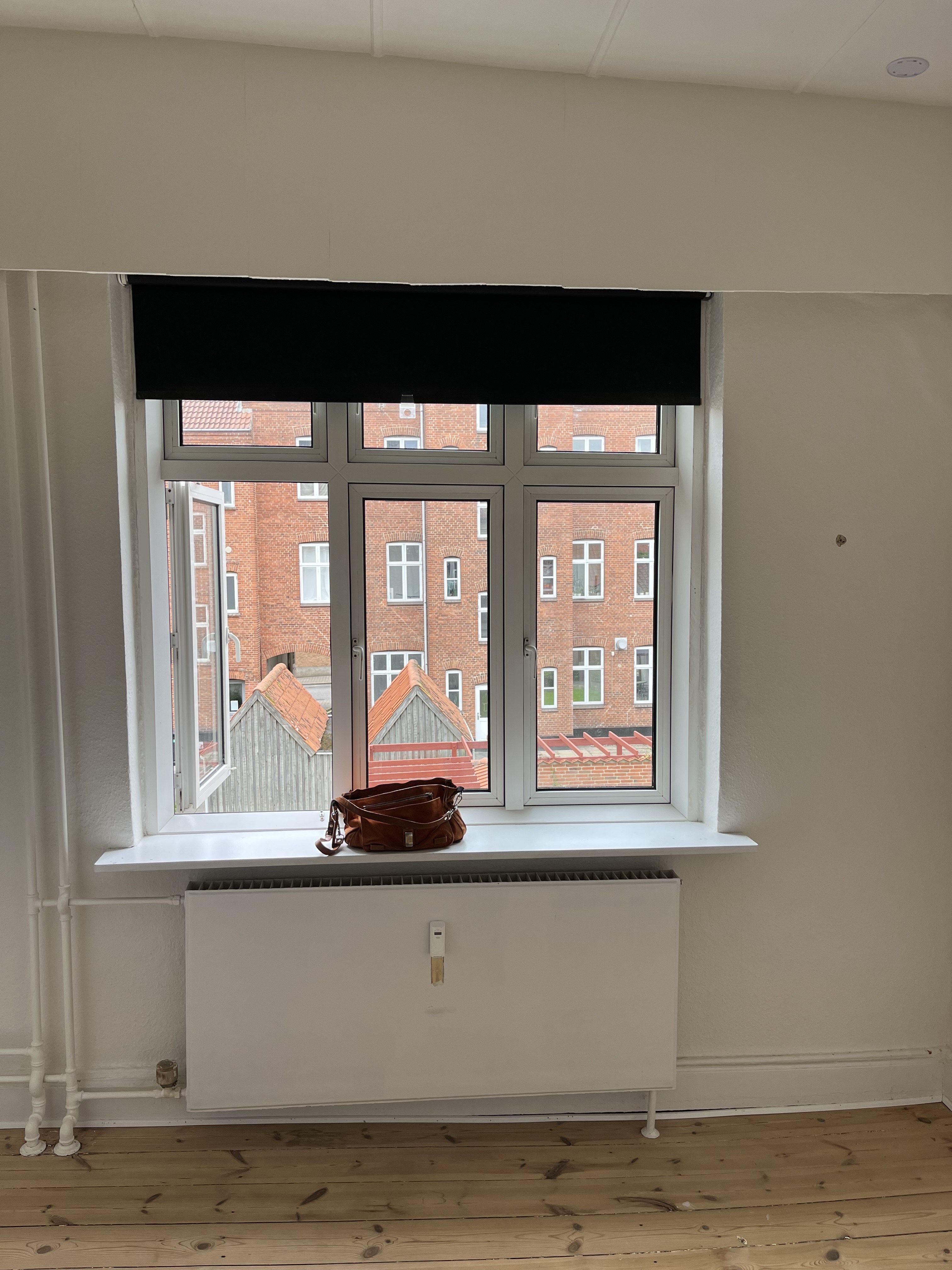 Lys og velholdt 2-værelses lejlighed på øverste etage