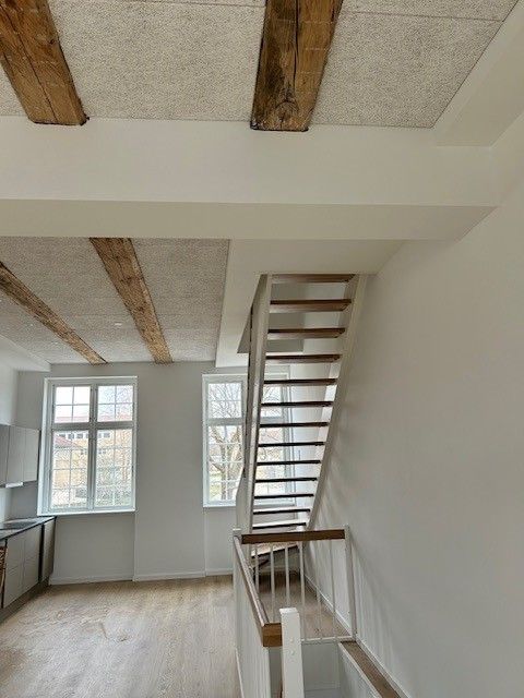 Moderne byhus i historisk bygning