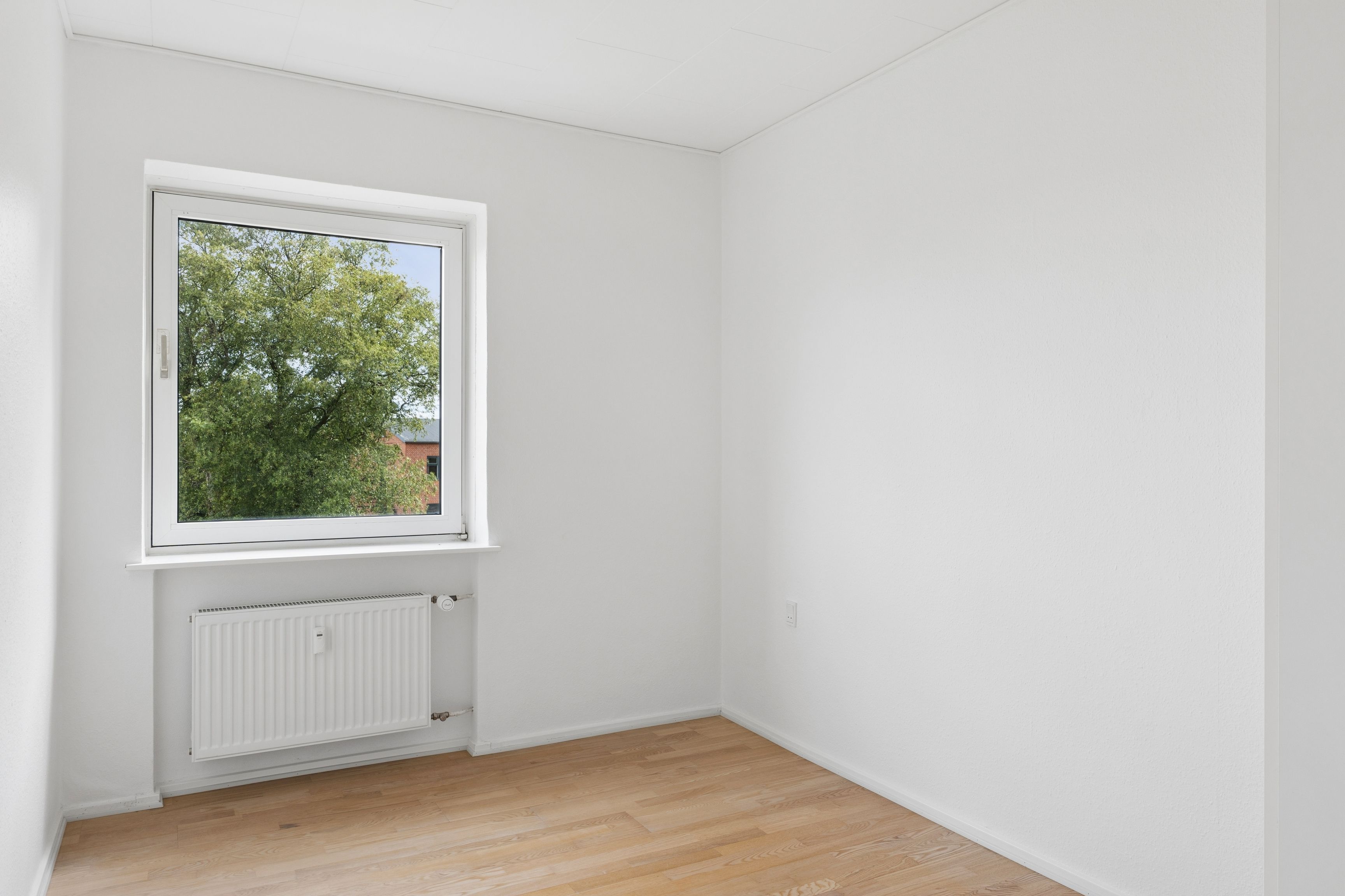 Nyrenoveret 3-værelses lejlighed med privat altan på øverste etage