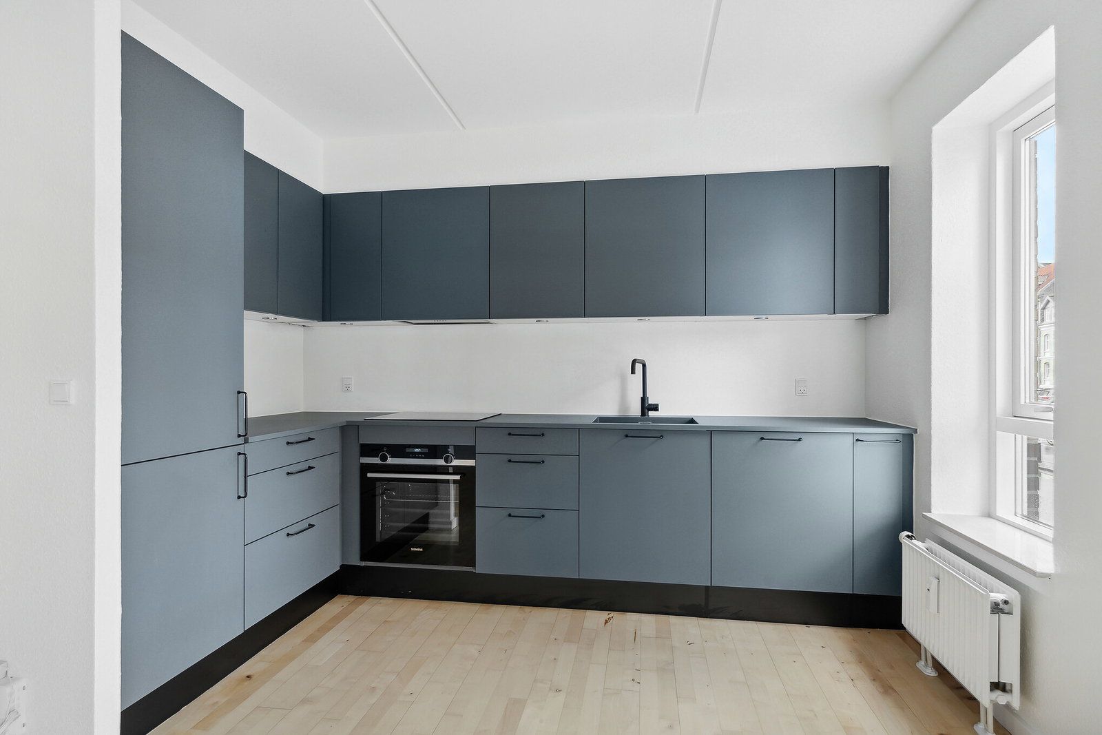 Lys 2-værelses på 69 m2 med moderne køkken, elevator og grøn gård – gratis fitness og delebil