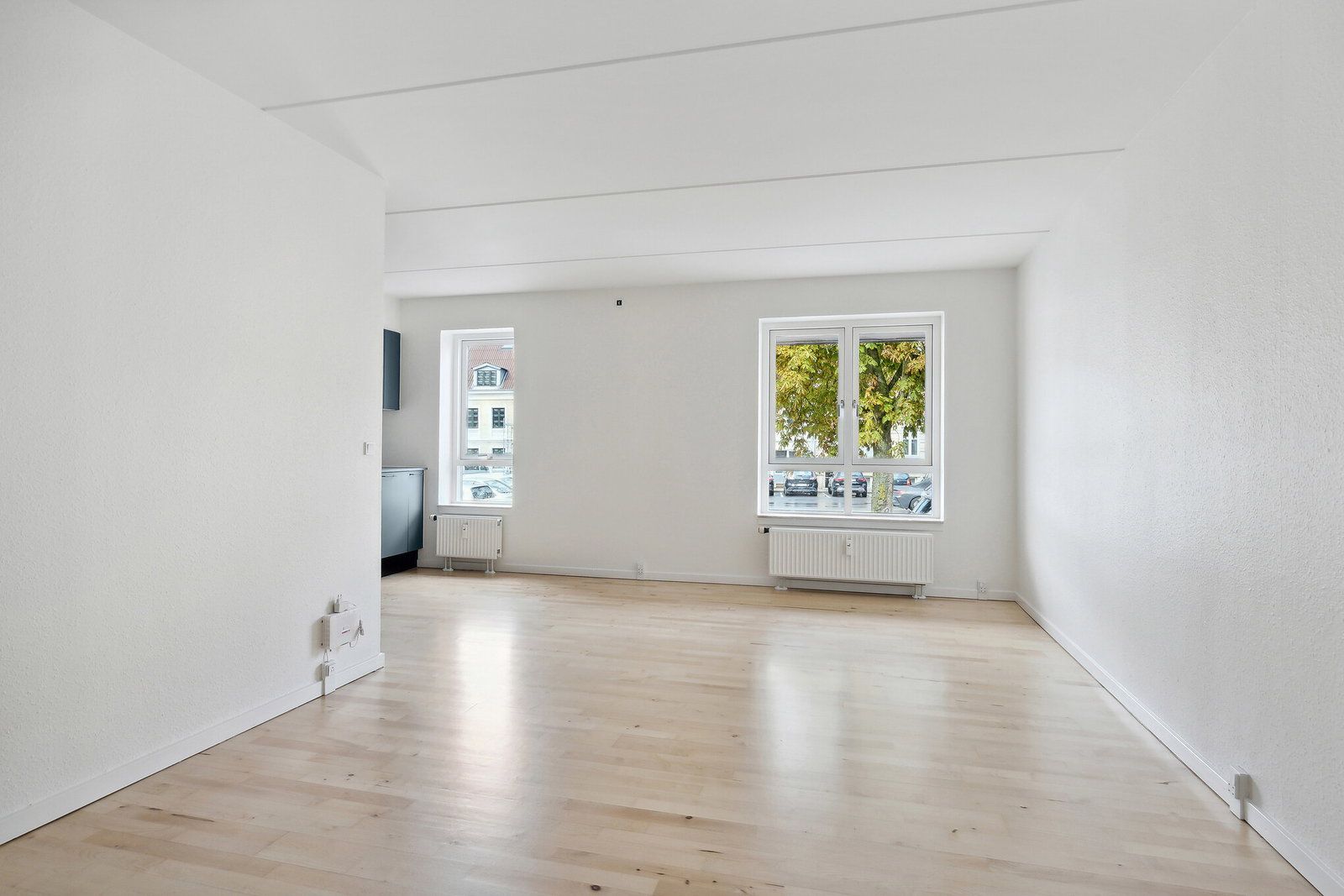 Lys 2-værelses på 69 m2 med moderne køkken, elevator og grøn gård – gratis fitness og delebil