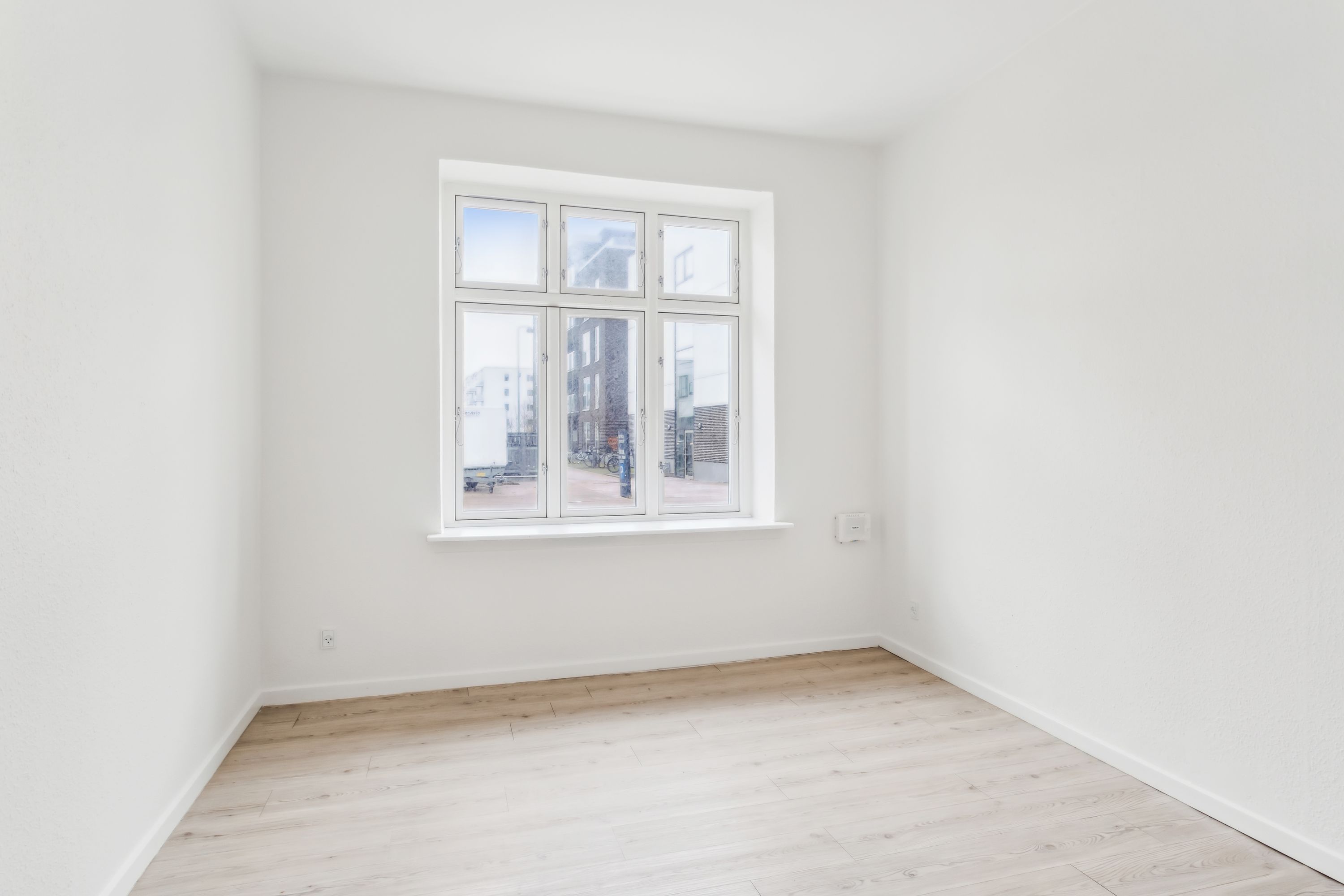 Rummelig 4-værelses lejlighed på 90 m² med direkte udgang til baggård